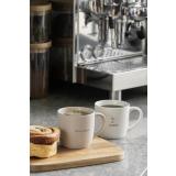 tekstkopper på fjøl med kanelbolle