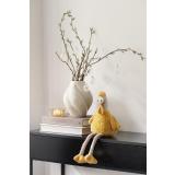 Konsollbord pyntet med vase, telysholder og påskehøne