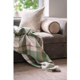 Pledd Tartan liggende på en sofa