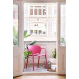 Stol i rosa på balkong