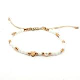 Knytearmbånd med hvite stener