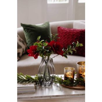 Stilkblomst Amaryllis rød i vase på sofabord