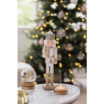 Duftlys krukke brun på sofabord med nøtteknekker