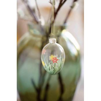 påskeegg i glass med påmalte blomster