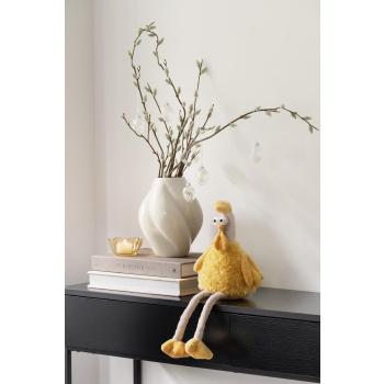 Konsollbord pyntet med vase, telysholder og påskehøne