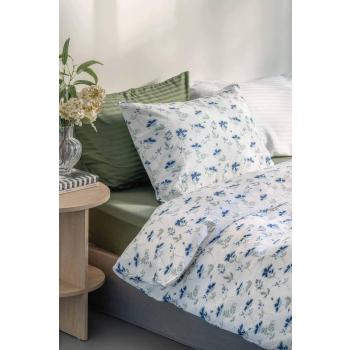 Sengetøy i krepp med blomster i seng med sateng sengesett i grønn